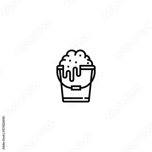 This black-and-white line icon depicts a bucket filled with foamy soap or suds, overflowing from the top. It represents cleaning, hygiene, or sanitation activities, and is commonly associated with spa