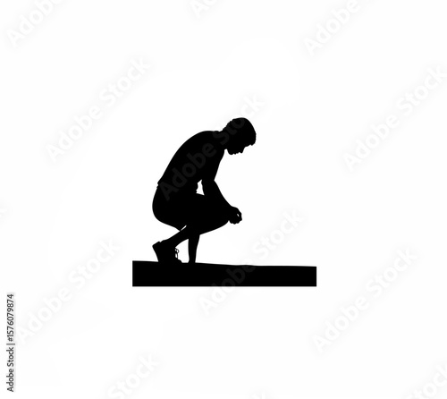 Silhouette of person squatting and staring at ground silently on white background