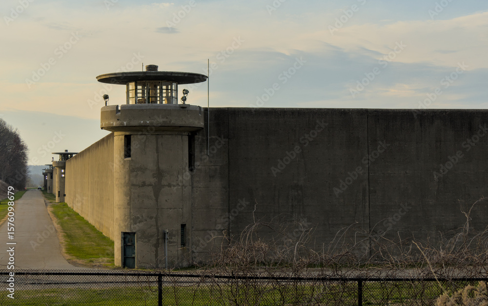 Obraz premium Fishkill Correctional Facility multi-security level prison in New York, United States wither guard tower at sunset (jail, prisoner, prisoners, crime)