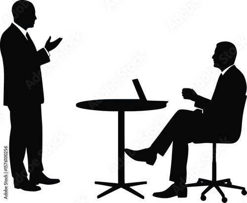 Silhouette showing a standing person explaining to seated colleague holding cup in formal work meeting
