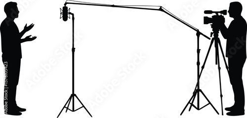 Silhouette of video shoot with presenter and camera operator in studio setup with boom mic