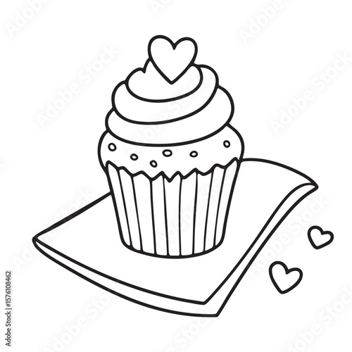 A small cake with a heart on top placed by a napkin