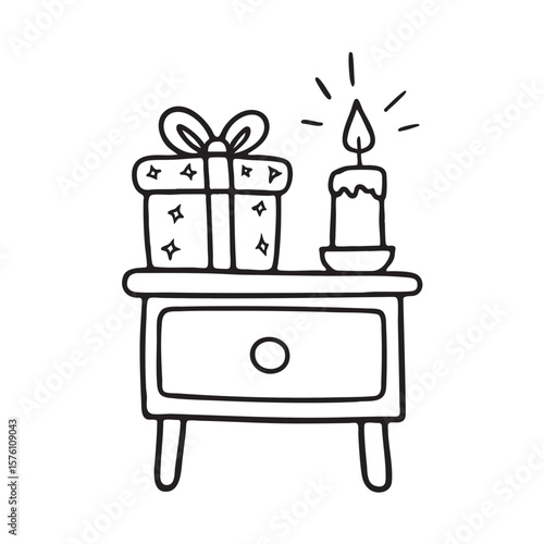 A nightstand holding a gift box and small candle