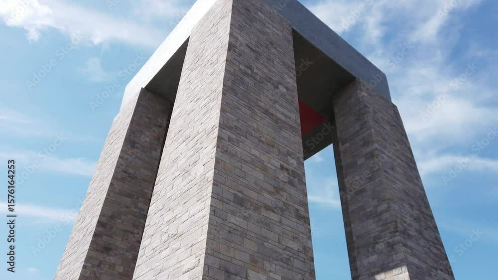 The canakkale martyrs memorial stands tall against a blue sky The canakkale martyrs memorial stands tall against a blue sky