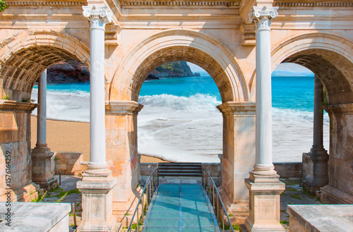 Fototapeta Naklejka Na Ścianę i Meble -  View of Hadrian's Gate in old city of Antalya with Cleopatra beach in Alanya - Antalya, Turkey