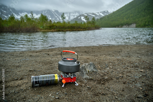 camping kettle with mountains in the background