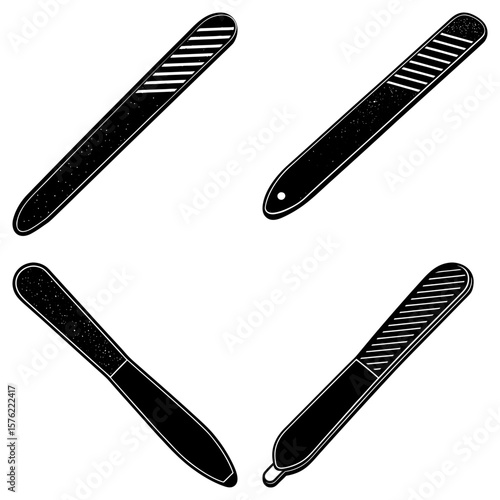 A collection of four black and white nail files with different designs and textures displayed together