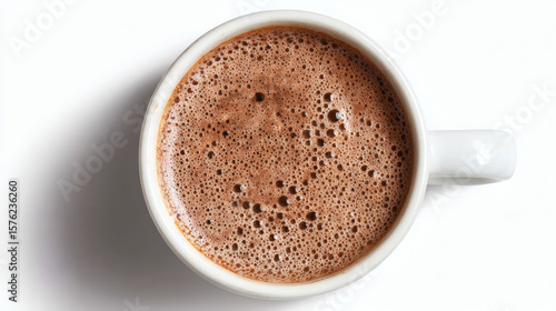 An overhead view of a steaming cup of hot chocolate with a creamy foam.