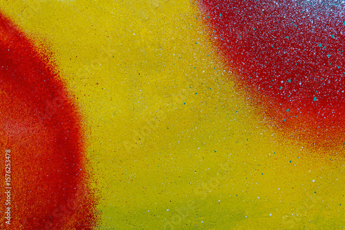 colorful background pattern of urban streen wall graffiti for concept and design. Aerosol bright vivid painting on a city walls