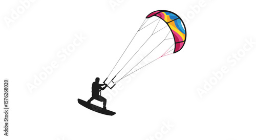 Kiteboarding. Kitesurfer riding on surfboard against colorful kite in the sky  