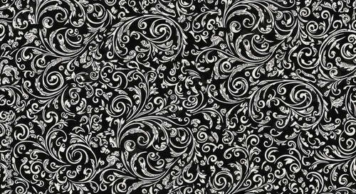 Intricate white floral swirls on a black background a detailed elegant pattern