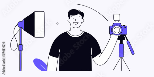 A smiling photographer stands with a camera and lighting equipment in a studio setting, perfect for photography business concepts and design projects.