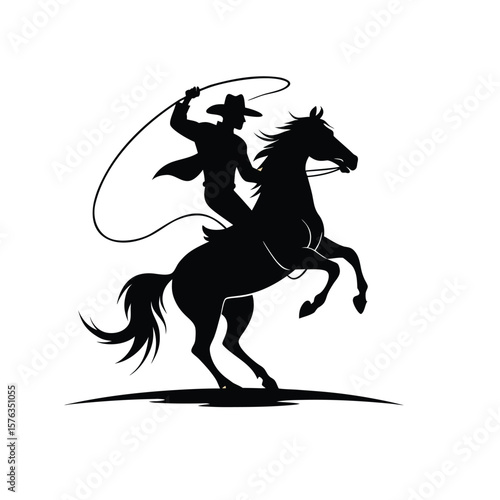 Silhouette of a cowboy on a rearing horse with a lasso against a light background
