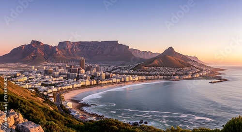 Iconic cape town cityscape bathed in golden sunrise light with table mountain and lion s head prominent landmarks