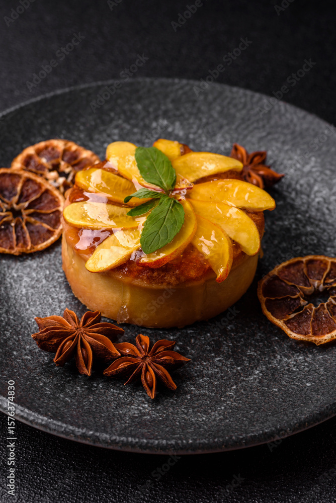 Fototapeta premium Sweet round pie or tart with apples and peach. Mini sweet tart