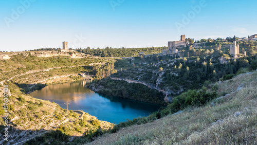 Overview of the village of Alarcón with the Jucar River and the walled enclosure of the castle, declared a historic-artistic site.
