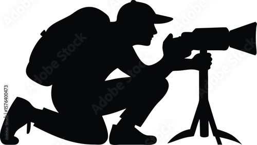 Photographer Silhouette with Camera on Tripod Capturing Shot