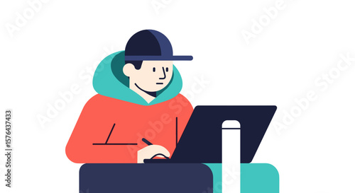 Young man working on laptop while sitting at a desk indoors  