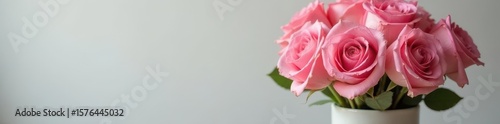 A cluster of fresh pink roses in a simple ceramic vase , bloom, interior, elegance