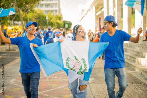 Fototapeta Group of Latino friends celebrating Guatemala's independence celebrations