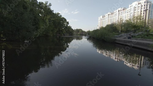 Beautiful scenic views of urban rivers, showcasing reflections and lush greenery all around