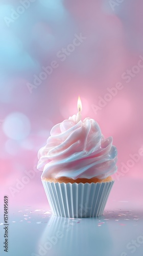 Celebrate With a Beautifully Frosted Cupcake Topped With a Candle Glowing Aga...