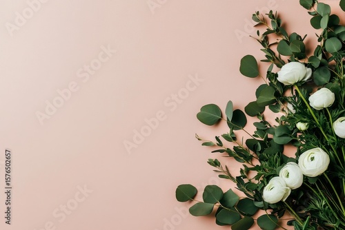 Elegant Bouquet of White Flowers and Greenery on a Soft Pink Background for D...