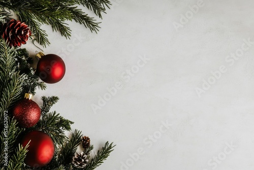 Christmas Ornaments and Greenery Arranged on a Soft White Surface During the ...