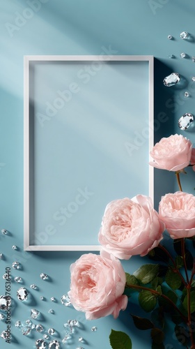Beautiful Pink Roses Arranged Around a Decorative Blank Frame on a Calming Bl...