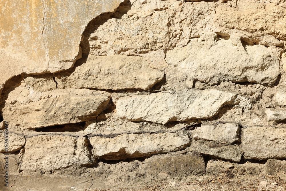 Fototapeta premium Texture of old stone wall as background, closeup