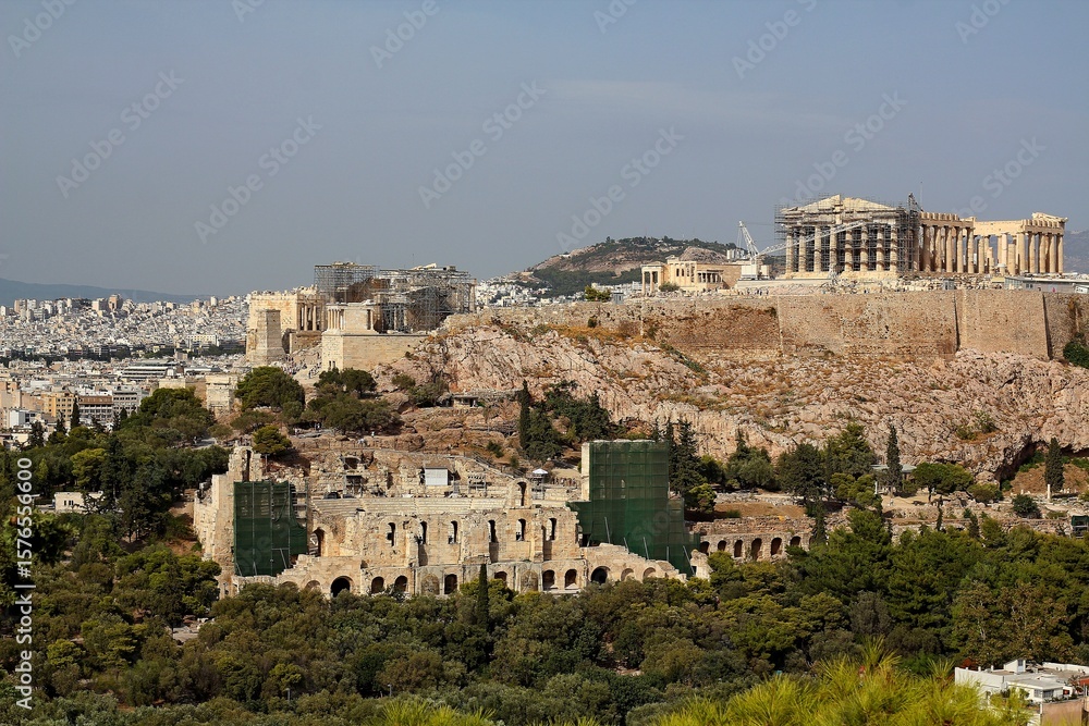 Naklejka premium Panoramic view of Athens with Acropolis hill on a hot summer day in Greece. Reconstruction period