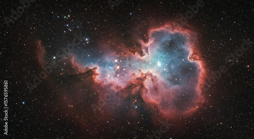 A vibrant nebula with swirling gas in blue, pink, and purple hues, surrounded by bright, twinkling stars. The image employs high contrast to highlight the celestial details.