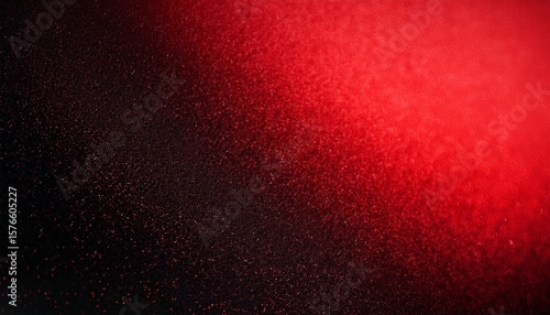 abstract red and black gradient background with grainy texture and noise effect featuring scattered particles on the left transitioning to solid color on the right