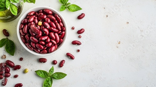 Red kidney beans in a bowl, garnished with fresh basil