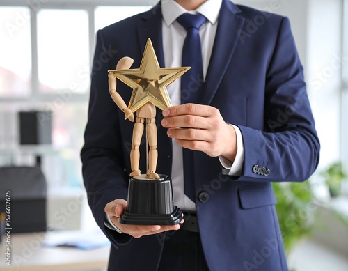 Businessman holding award