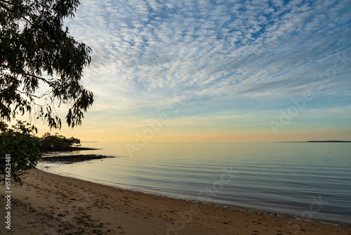 Wallpaper Mural Golden hour view across the calm waters of Moreton Bay, from Morwong Beach. Coochiemudlo Island, Queensland, Australia  Torontodigital.ca