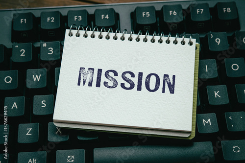 Obraz na plátne There is notebook with the word Mission