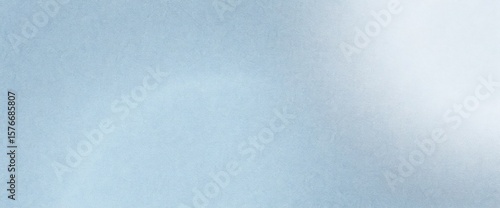 Light blue textured background with subtle gradient and soft diffused lighting effect on the right side