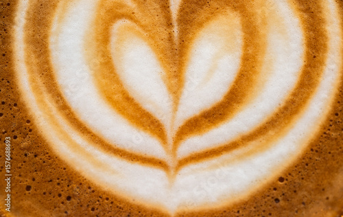 Full frame shot of the surface of hot latte coffee. A latte is a coffee drink made with espresso and steamed milk.
