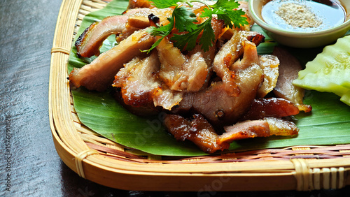 Fotografía Grilled pork neck on a bamboo plate