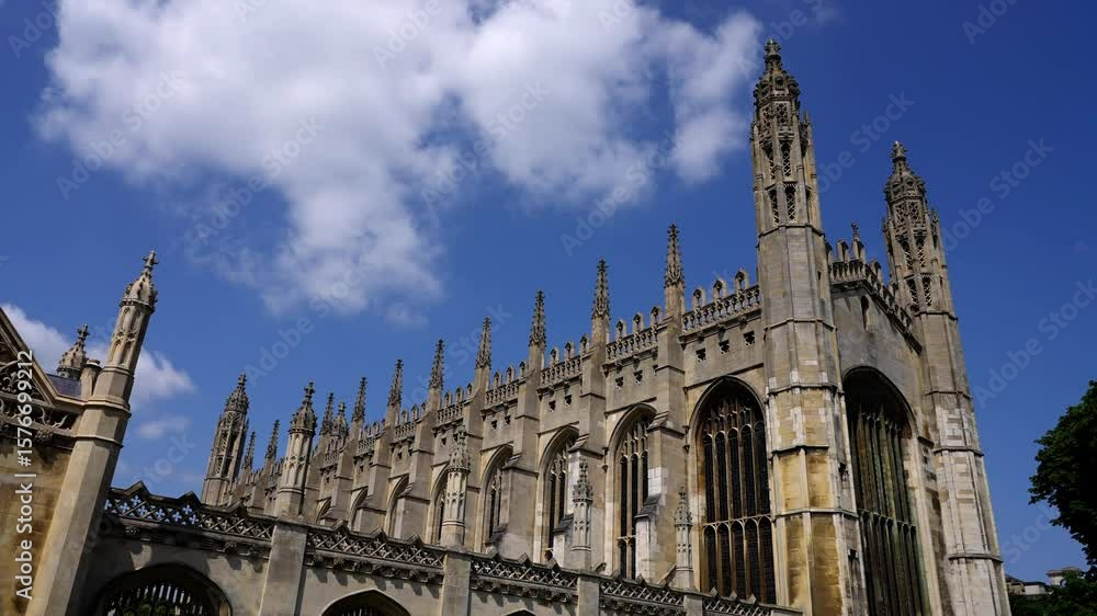 Majestic architecture of King s College Chapel under a blue sky with some clouds in Cambridge, UK Majestic architecture of King s College Chapel under a blue sky with some clouds in Cambridge, UK