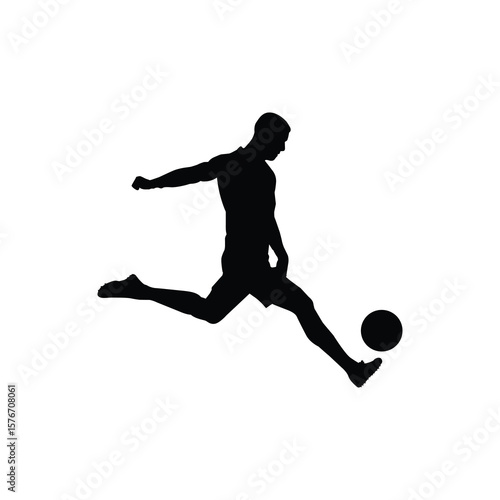 Silhouette of Soccer Player Kicking Ball