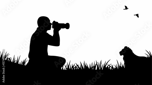 Silhouette of a man with camera, lion in grass, and birds flying in a black and white wildlife scene