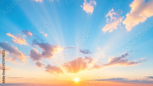 Fototapeta Naklejka Na Ścianę i Meble -  A spectacular sunrise illuminating the sky with vibrant colors and soft clouds, symbolizing hope and new beginnings.