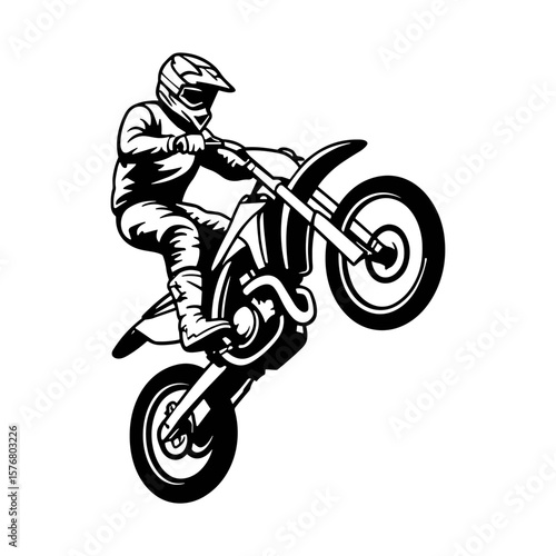Motocross rider performing a wheelie on a dirt bike