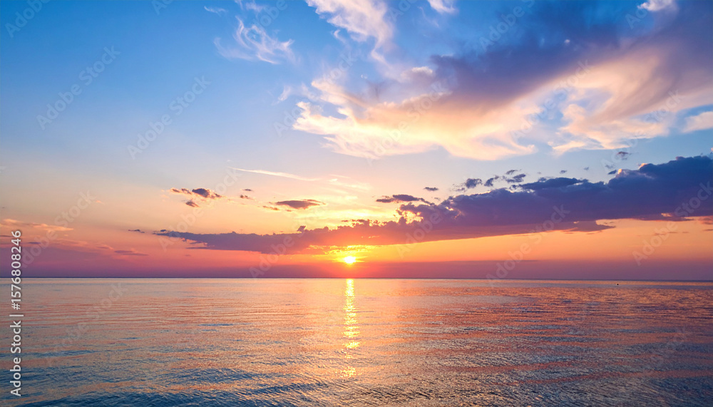 Fototapeta premium Serene Sunset Seascape: A breathtaking sunset paints the sky with vibrant hues of orange, pink, and purple, as the sun dips below the horizon, casting a warm glow on the calm ocean waters. 