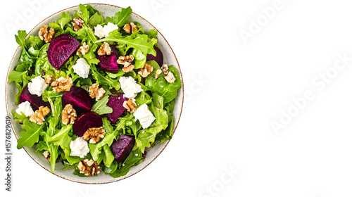 Beetroot salad with walnuts and goat cheese on black background top view