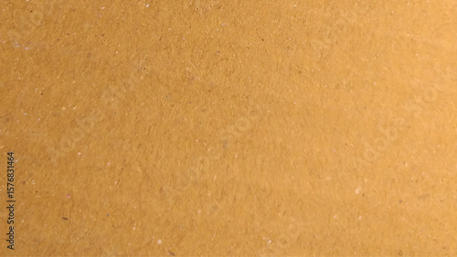 Background of brown kraft paper or cardboard texture. Abstract pattern of beige rough carton, old paper sheet, parchment or papyrus surface.