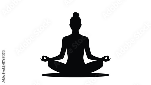 Silhouette of a woman meditating in lotus pose with hands in gyan mudra