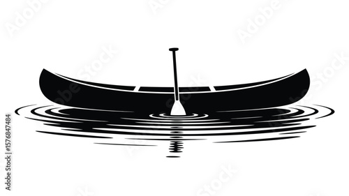 Black silhouette of a canoe with a paddle in rippling water